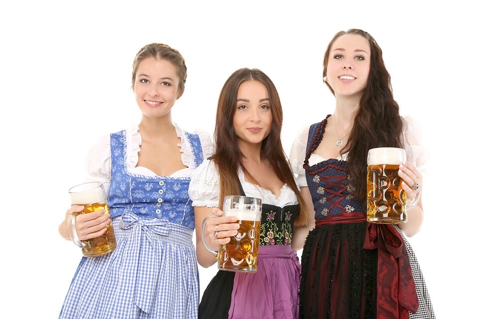 Waitress carrying mugs